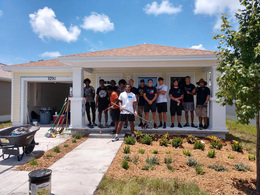 Football Team Helps at Habitat for Humanity House
