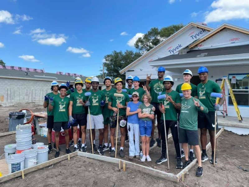 USF men’s basketball team assists Habitat for Humanity on ‘extra special’ home
